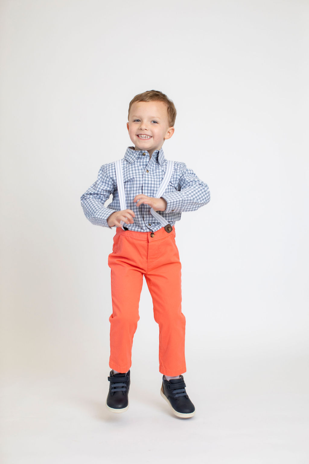 boy in suspenders portrait