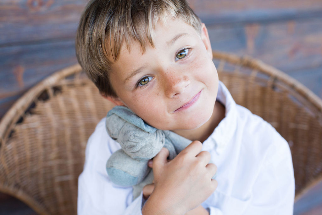 boy with stuffed animal portrait