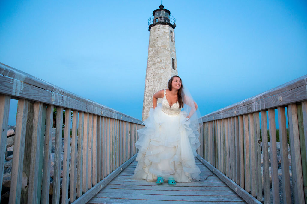 bride at lighthouse evening