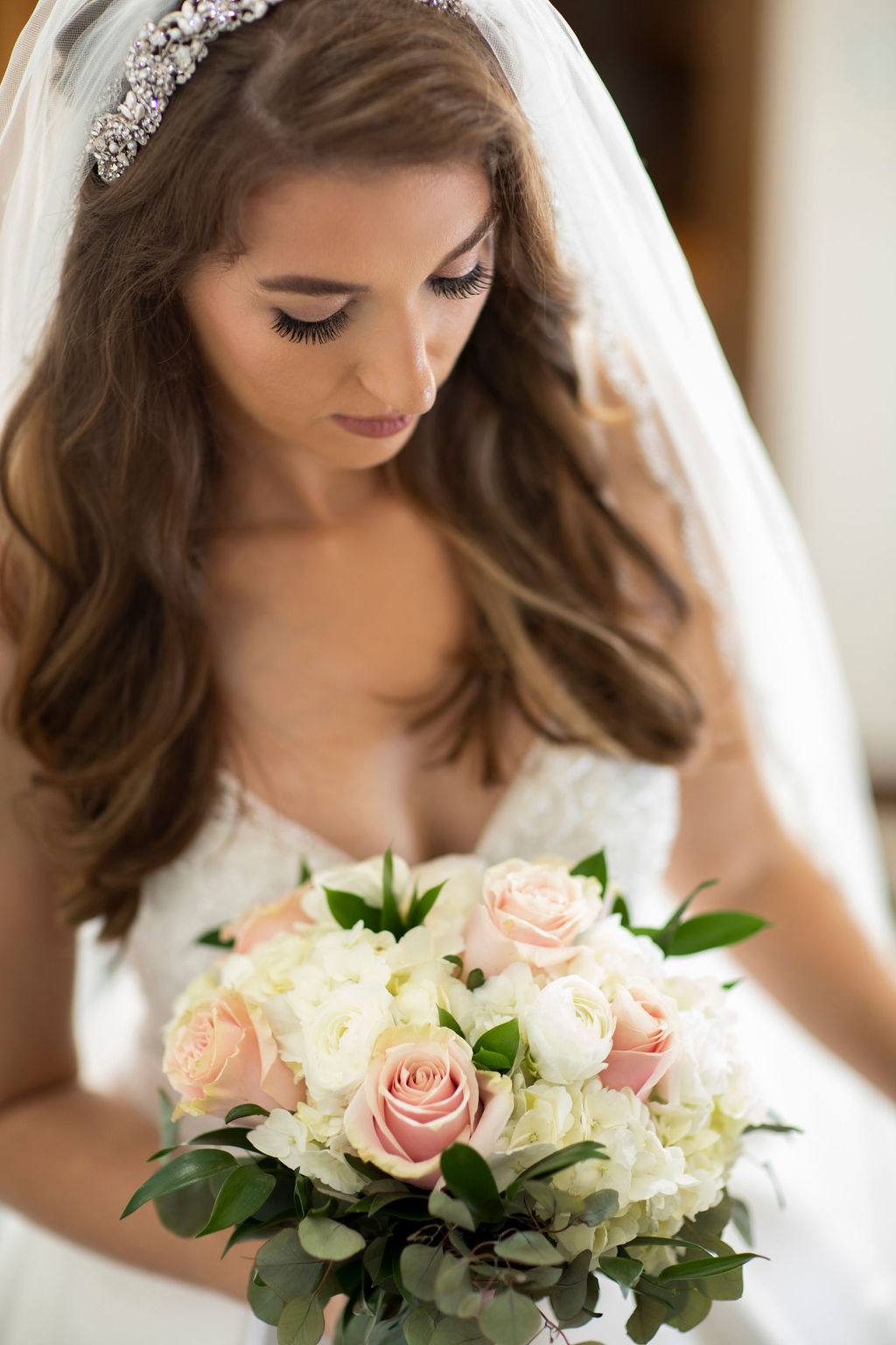 bride looking over flowers
