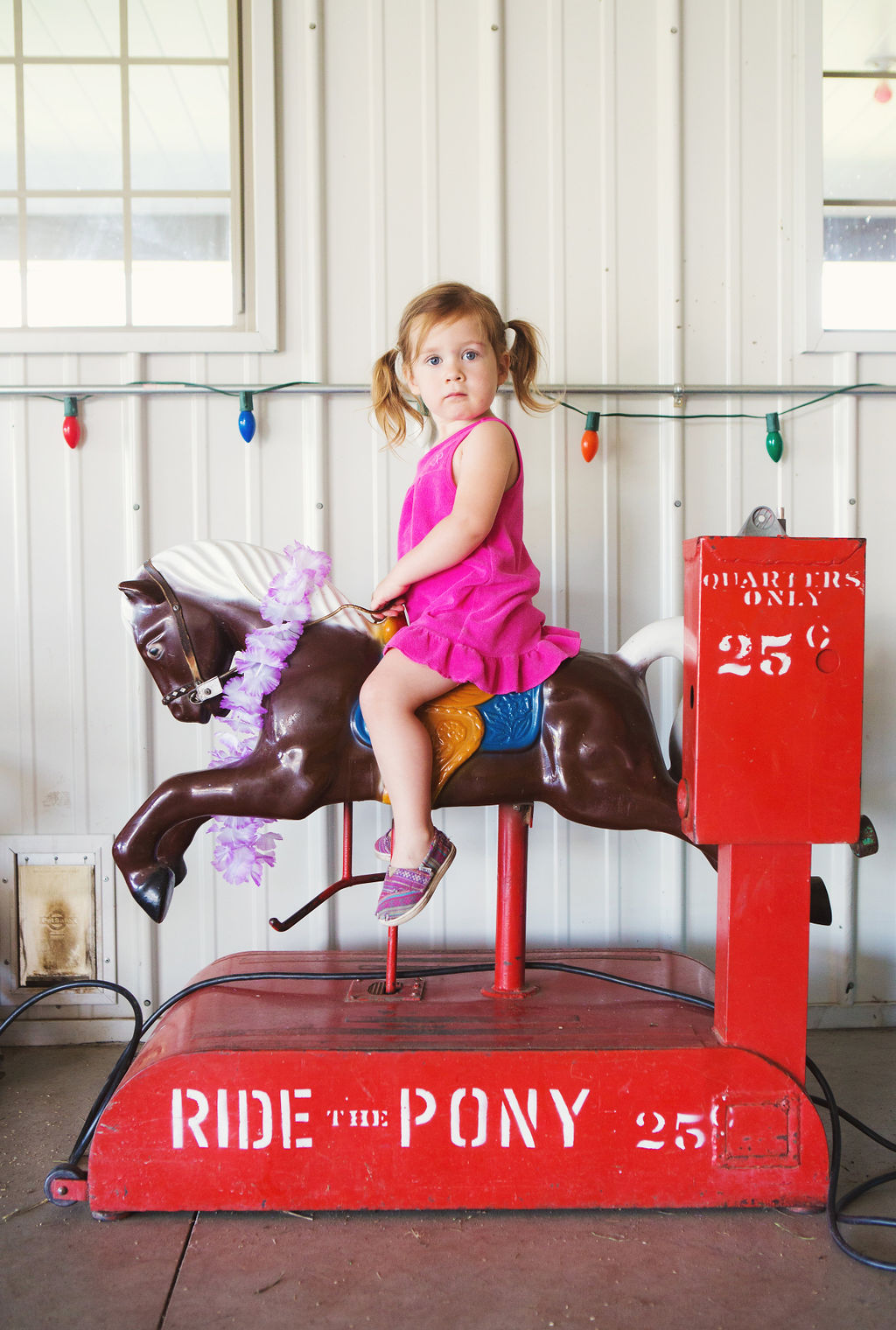 girl riding mechanical pony classic portrait