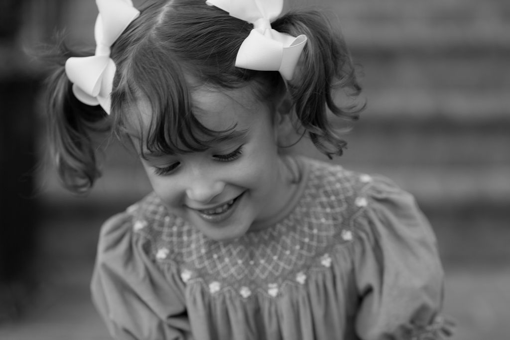 girl with bows black and white portrait