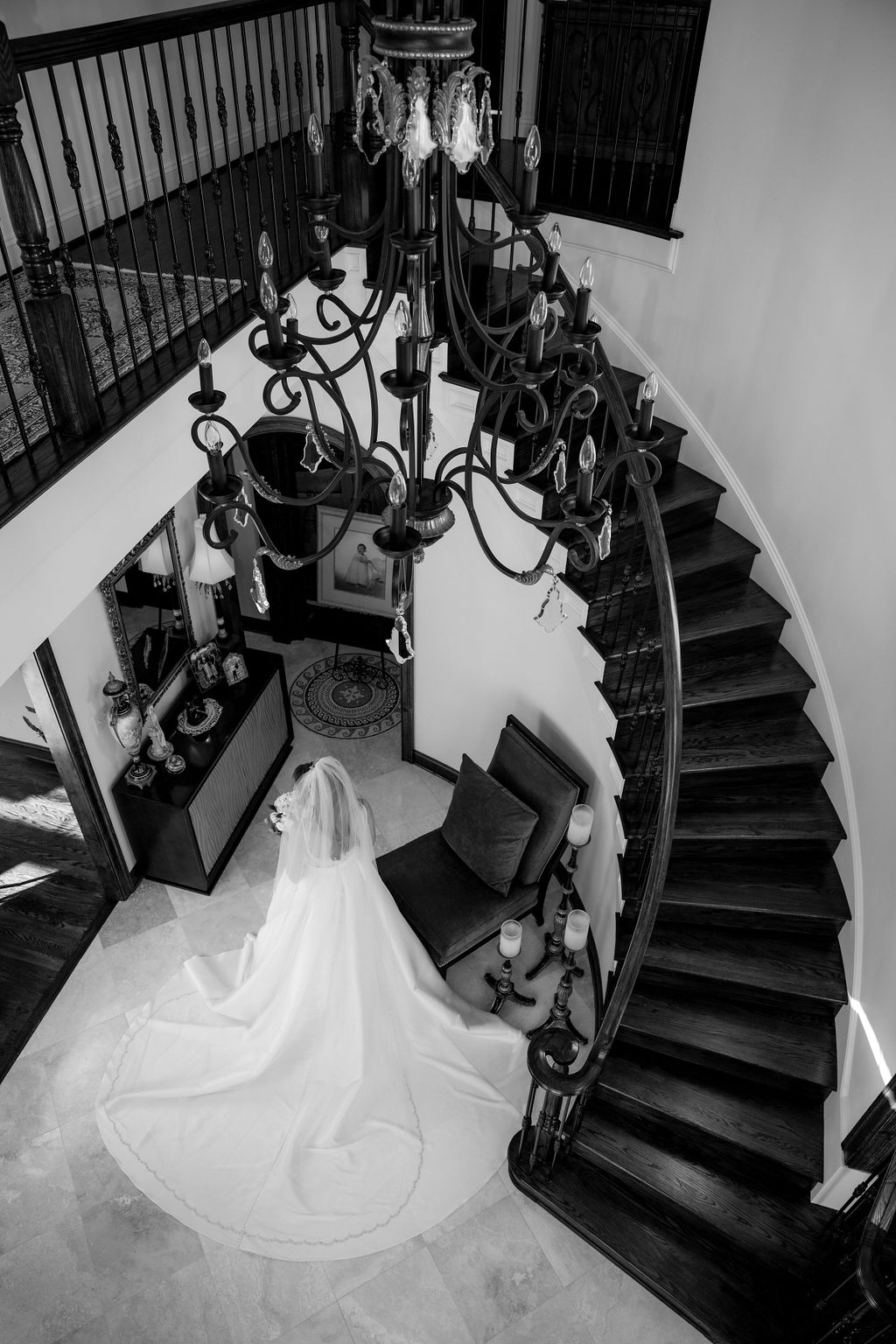 looking down on bride at stairwell black and white
