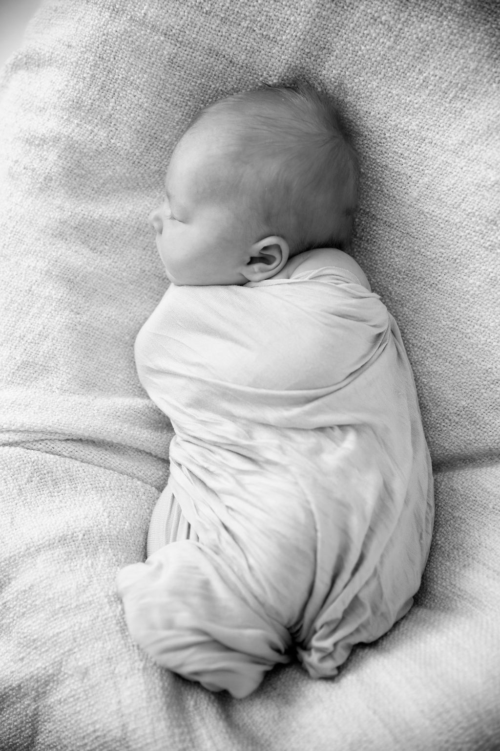 sleeping newborn side profile black and white portrait