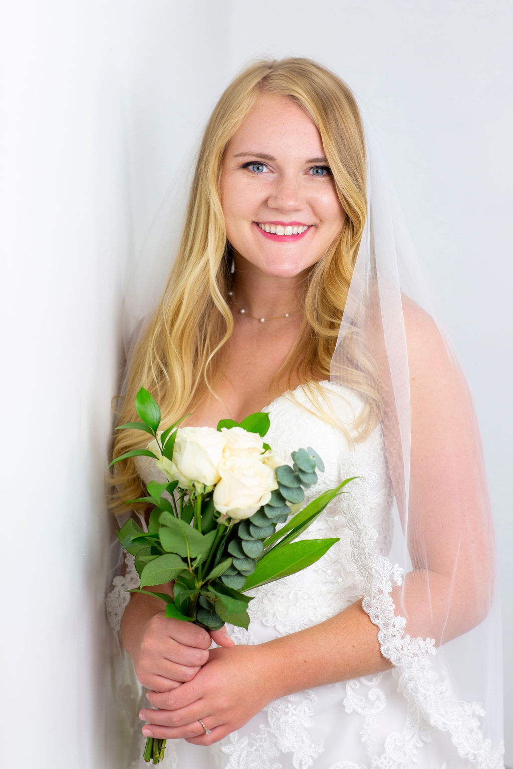smiling bride holding flowers