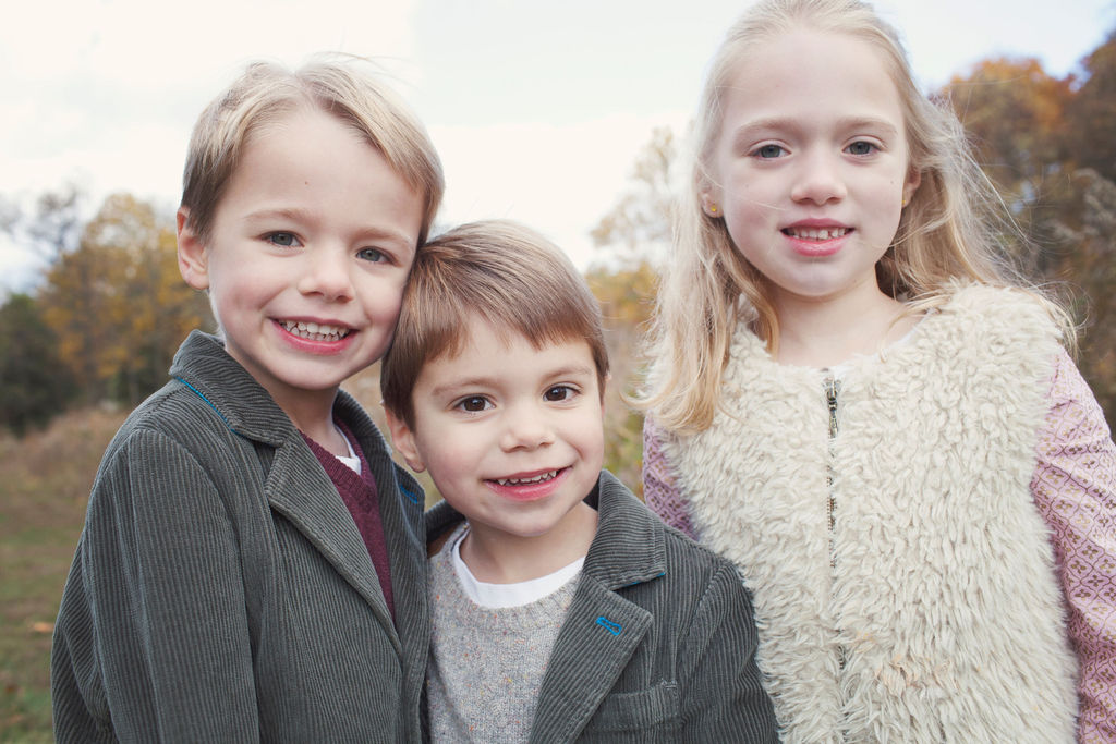 three kids smiling portrait